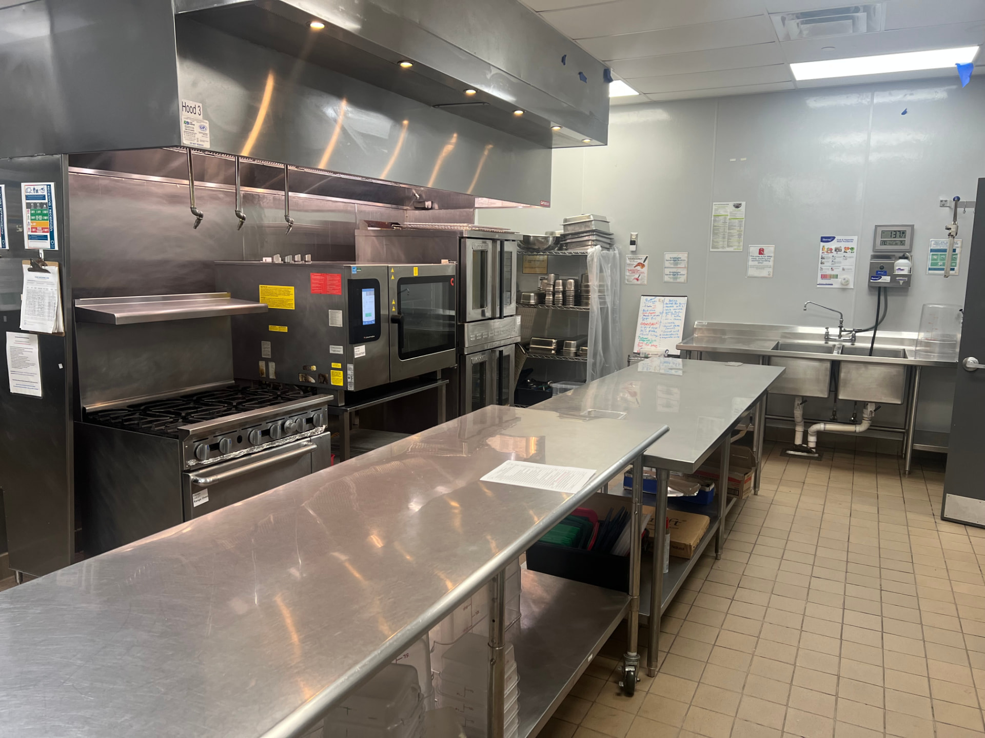 Commercial kitchen cook line with range and combi oven after deep cleaning