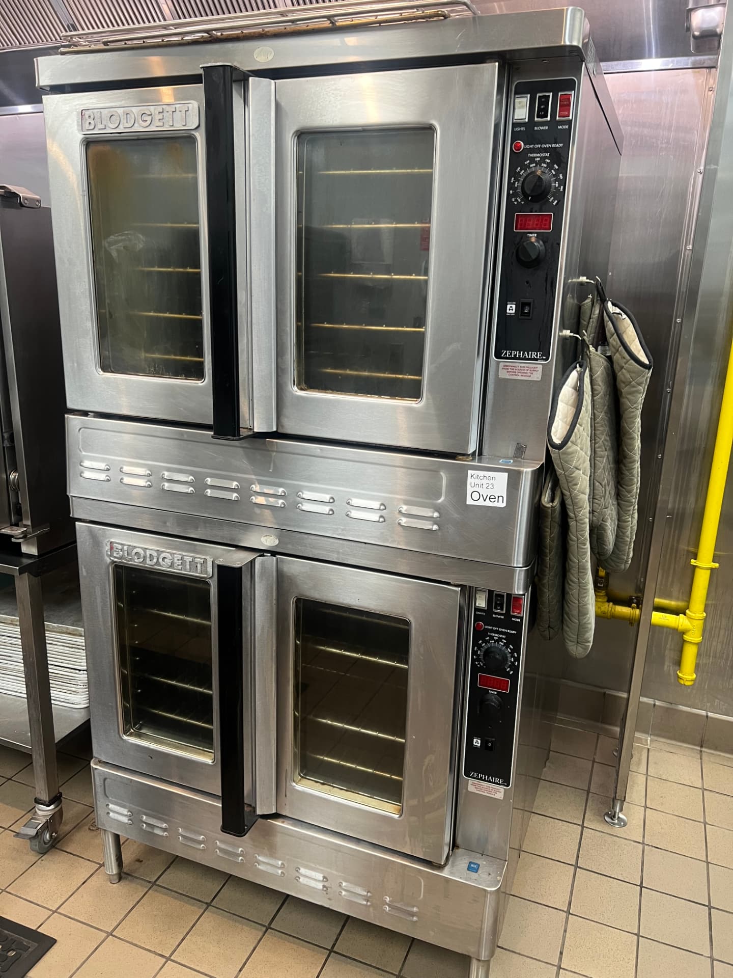 Double-stacked commercial convection oven in a stainless kitchen